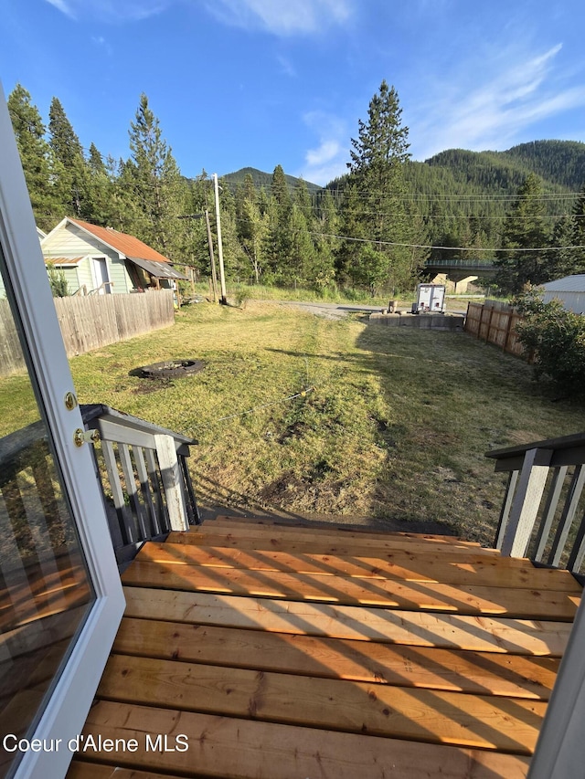 312 Park St, Mullan, ID 83846 - wooden terrace with a wooded view and a mountain view