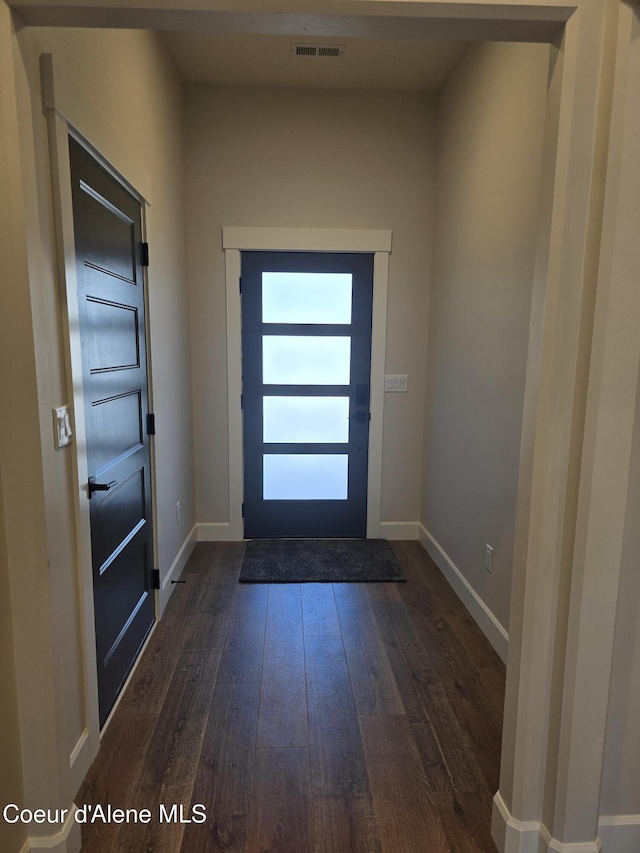 13916 N Rainier Loop, Rathdrum, ID 83858 - entryway with dark wood-type flooring and baseboards