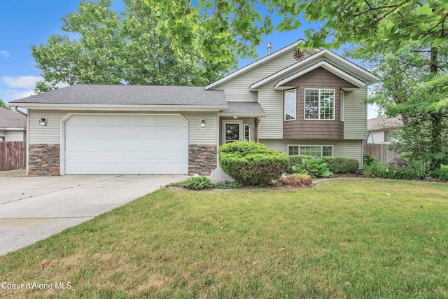 2665 W Broadmoore Dr, Hayden, ID 83835 - split level home featuring a garage, driveway, stone siding, and a shingled roof
