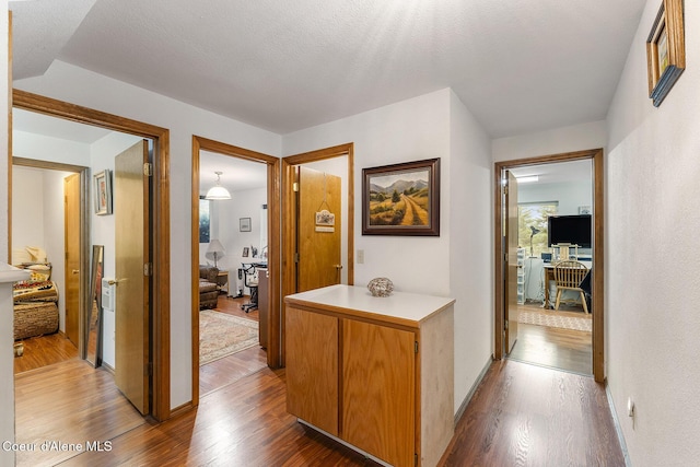 7605 W Sanders Rd, Coeur Dalene, ID 83814 - hall with wood finished floors