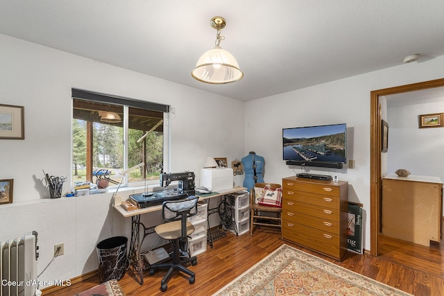 7605 W Sanders Rd, Coeur Dalene, ID 83814 - office area with radiator and wood finished floors
