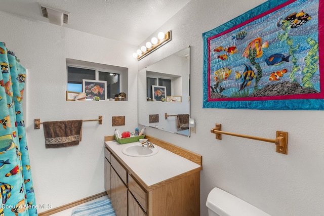 7605 W Sanders Rd, Coeur Dalene, ID 83814 - full bathroom featuring toilet and vanity