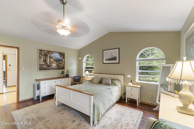 7605 W Sanders Rd, Coeur Dalene, ID 83814 - bedroom with multiple windows, lofted ceiling, wood finished floors, and ceiling fan