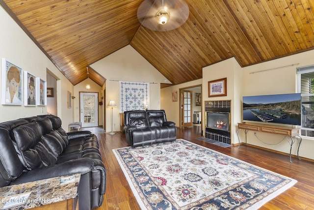 7605 W Sanders Rd, Coeur Dalene, ID 83814 - living area featuring a fireplace, lofted ceiling, wooden ceiling, hardwood / wood-style flooring, and a ceiling fan