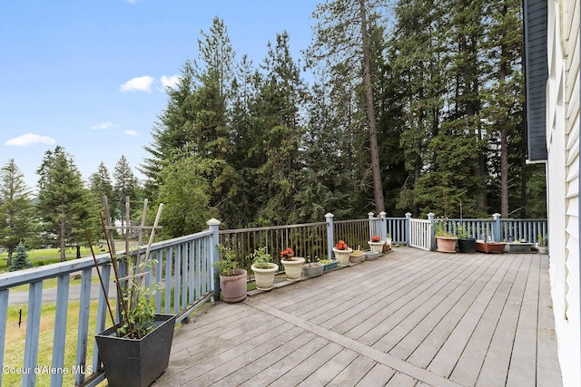 7605 W Sanders Rd, Coeur Dalene, ID 83814 - wooden deck with view of scattered trees