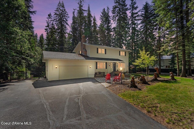 12321 N Sherwood Ct, Hayden, ID 83835 - traditional home with driveway and a garage