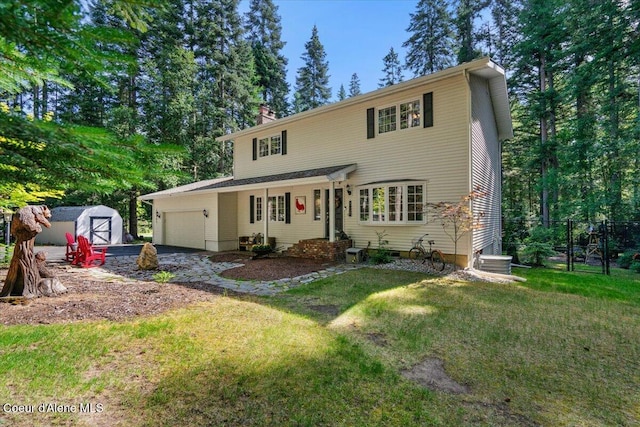 12321 N Sherwood Ct, Hayden, ID 83835 - traditional-style home with a garage, a storage shed, and a chimney