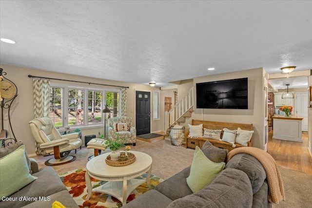 12321 N Sherwood Ct, Hayden, ID 83835 - living area with stairway, recessed lighting, a textured ceiling, and light wood-style flooring