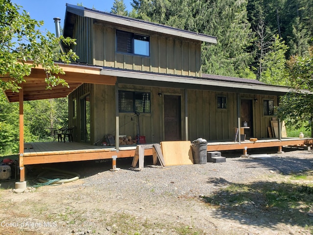 1007 Ruby Creek Rd, Naples, ID 83847 - back of house with board and batten siding and a deck