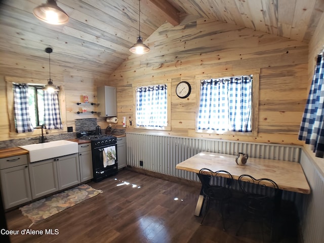 1007 Ruby Creek Rd, Naples, ID 83847 - kitchen with gas stove, vaulted ceiling, wood walls, wooden ceiling, and dark wood-style floors