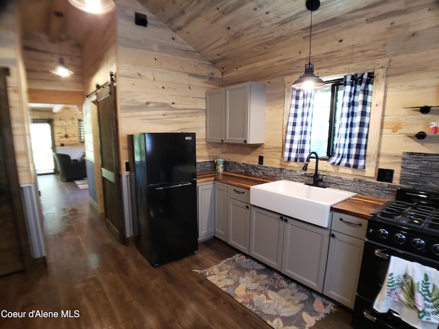 1007 Ruby Creek Rd, Naples, ID 83847 - kitchen with black appliances, butcher block countertops, lofted ceiling, wood ceiling, and dark wood-style flooring