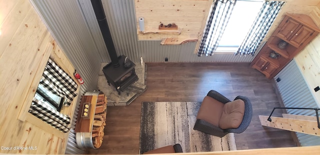 1007 Ruby Creek Rd, Naples, ID 83847 - living room featuring wood finished floors, a wood stove, and wood walls