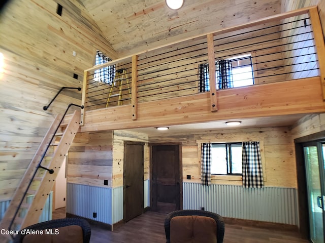 1007 Ruby Creek Rd, Naples, ID 83847 - unfurnished living room featuring wood walls, plenty of natural light, high vaulted ceiling, wood finished floors, and wood ceiling