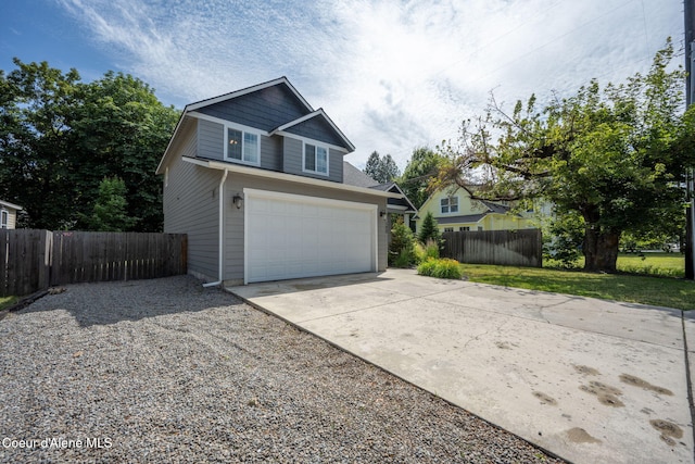 120 E Walnut Ave, Coeur Dalene, ID 83814 - view of front of house featuring concrete driveway and a garage