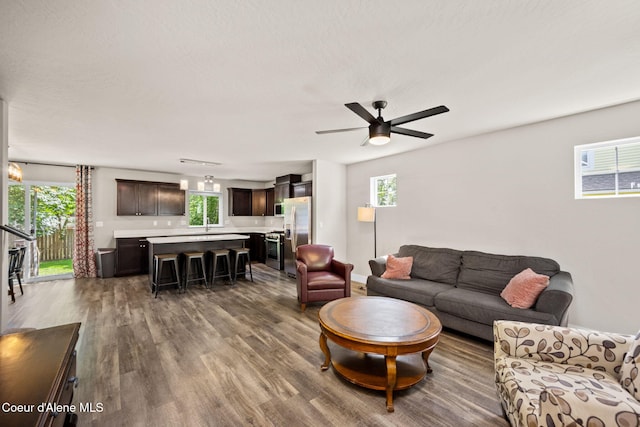 120 E Walnut Ave, Coeur Dalene, ID 83814 - living room with wood finished floors, plenty of natural light, and ceiling fan
