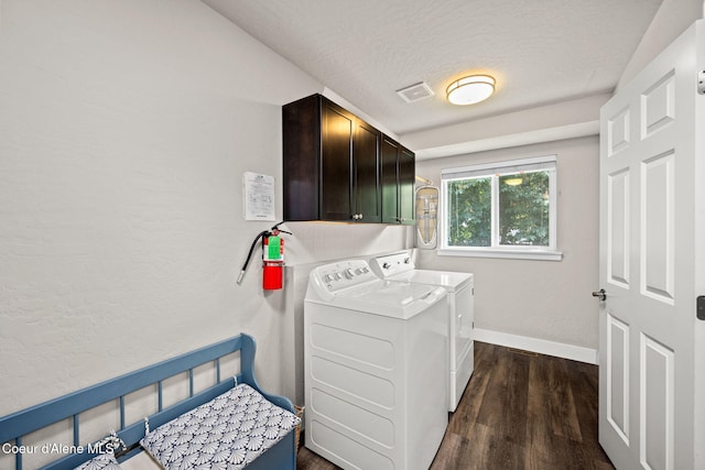 120 E Walnut Ave, Coeur Dalene, ID 83814 - laundry area featuring cabinet space, washing machine and clothes dryer, dark wood finished floors, and a textured ceiling