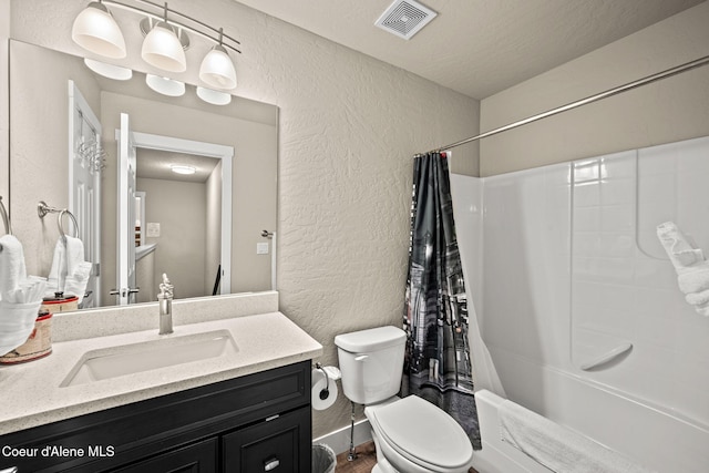 120 E Walnut Ave, Coeur Dalene, ID 83814 - full bath with a textured wall, shower / bath combo, vanity, and wood finished floors