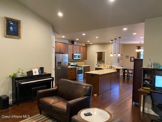 4310 Burns Ct, Sandpoint, ID 83864 - living area with dark wood-type flooring, recessed lighting, and a chandelier