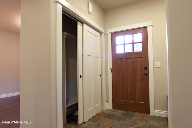 4310 Burns Ct, Sandpoint, ID 83864 - entrance foyer with baseboards and dark stone finish flooring
