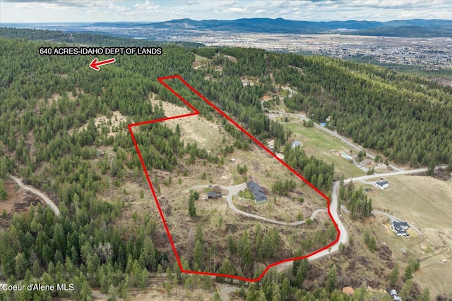 3772 S Schilling Loop, Post Falls, ID 83854 - aerial view of property and surrounding area featuring a forest and property parcel outlined