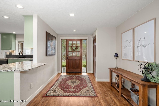 3772 S Schilling Loop, Post Falls, ID 83854 - foyer entrance with light wood-type flooring, recessed lighting, and a textured ceiling