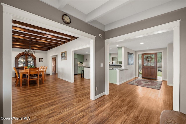 3772 S Schilling Loop, Post Falls, ID 83854 - foyer entrance with beam ceiling, wood finished floors, a chandelier, and recessed lighting