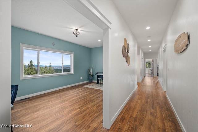 3772 S Schilling Loop, Post Falls, ID 83854 - hall with healthy amount of natural light, wood finished floors, and recessed lighting