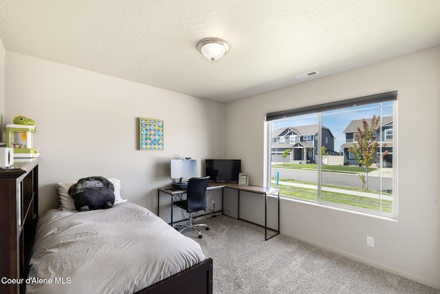 10413 N Belgrave Loop, Hayden, ID 83835 - bedroom with light colored carpet and an office area