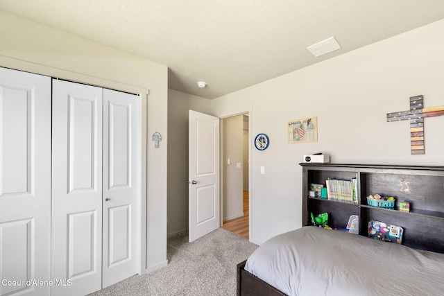 10413 N Belgrave Loop, Hayden, ID 83835 - carpeted bedroom with baseboards and a closet