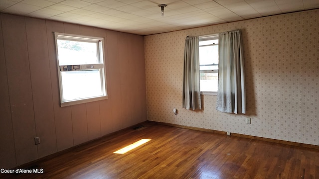 405 W Mullan Ave, Kellogg, ID 83837 - unfurnished room with hardwood / wood-style floors and healthy amount of natural light