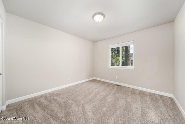 3420 N 19th St, Coeur Dalene, ID 83815 - carpeted spare room with baseboards