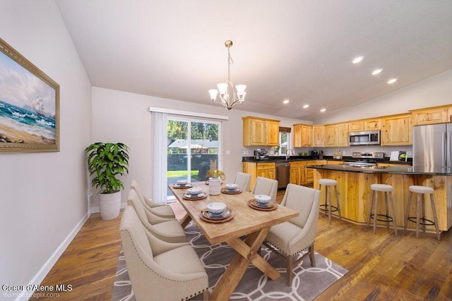 3420 N 19th St, Coeur Dalene, ID 83815 - dining area featuring lofted ceiling, a chandelier, recessed lighting, and dark wood-style flooring