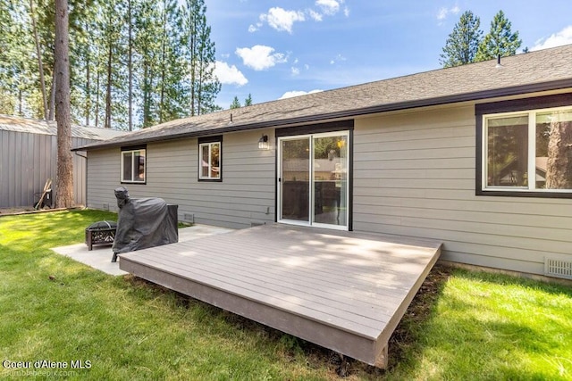 3420 N 19th St, Coeur Dalene, ID 83815 - back of property with an outdoor fire pit, a wooden deck, and a lawn
