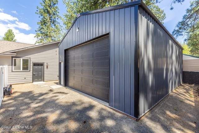 3420 N 19th St, Coeur Dalene, ID 83815 - garage featuring asphalt driveway