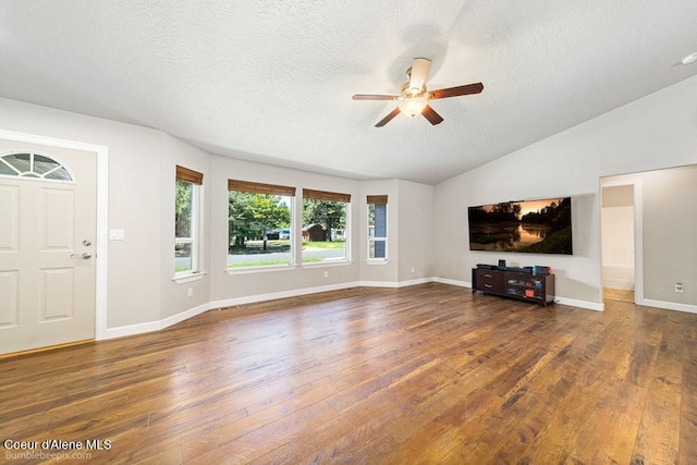 3420 N 19th St, Coeur Dalene, ID 83815 - unfurnished living room with a ceiling fan, wood finished floors, a textured ceiling, and lofted ceiling