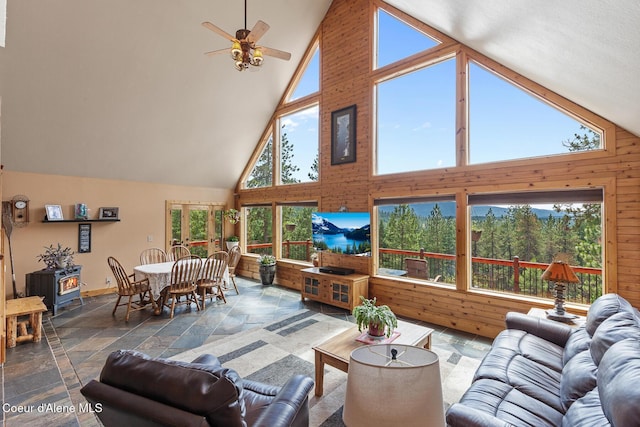 1529 S Saddleback Dr, Coeur Dalene, ID 83814 - living room featuring high vaulted ceiling, plenty of natural light, stone tile floors, and ceiling fan