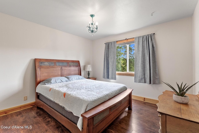 1529 S Saddleback Dr, Coeur Dalene, ID 83814 - bedroom with wood finished floors and a chandelier