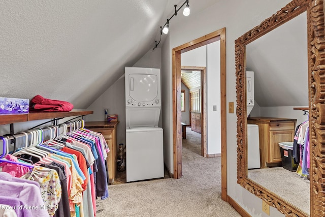 1529 S Saddleback Dr, Coeur Dalene, ID 83814 - spacious closet with stacked washing machine and dryer, light carpet, and lofted ceiling