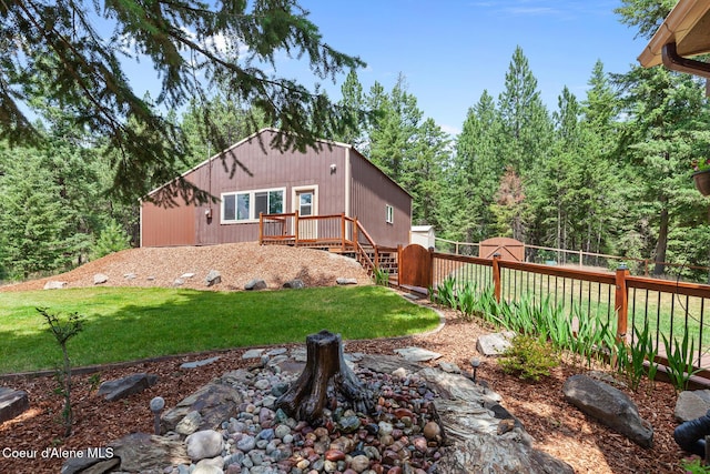 1529 S Saddleback Dr, Coeur Dalene, ID 83814 - back of property featuring a wooden deck and a wooded view