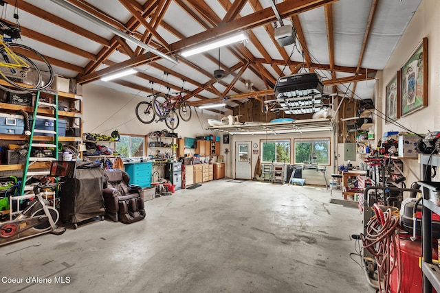 1529 S Saddleback Dr, Coeur Dalene, ID 83814 - garage featuring a workshop area and a garage door opener