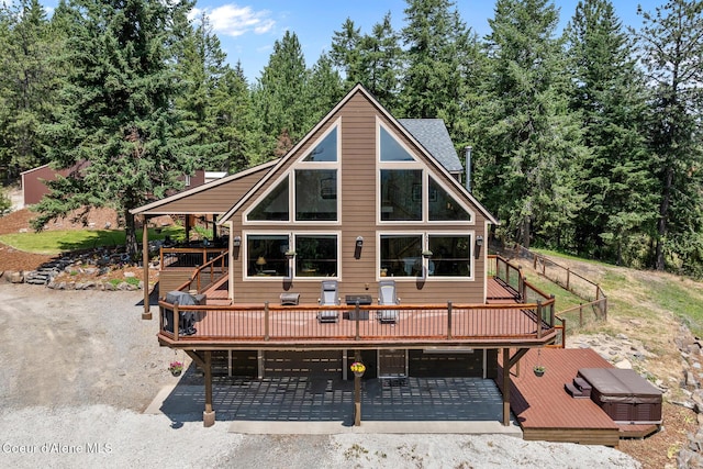 1529 S Saddleback Dr, Coeur Dalene, ID 83814 - back of house with a wooden deck, stairs, and gravel driveway