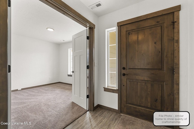 LT5BLK1 E Valley St, Oldtown, ID 83822 - foyer entrance featuring baseboards and wood finished floors