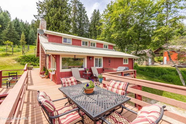 19441 N Rustic Ridge Trl, Rathdrum, ID 83858 - wooden deck featuring outdoor dining space and a grill