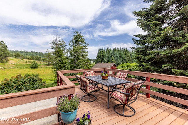 19441 N Rustic Ridge Trl, Rathdrum, ID 83858 - deck featuring outdoor dining area and a wooded view