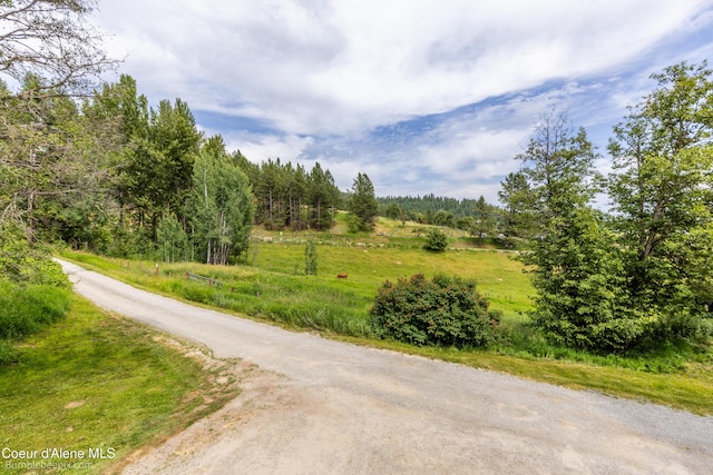 19441 N Rustic Ridge Trl, Rathdrum, ID 83858 - view of asphalt street with a wooded view