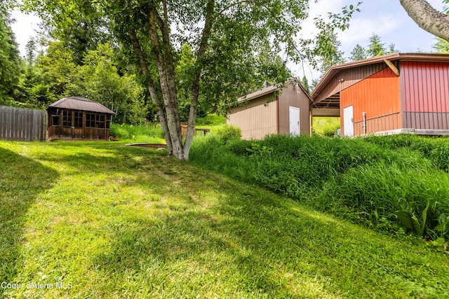 19441 N Rustic Ridge Trl, Rathdrum, ID 83858 - view of yard with an outdoor structure and an outbuilding