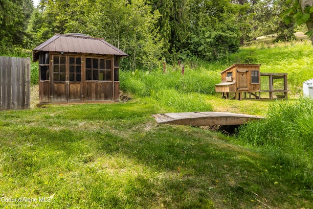19441 N Rustic Ridge Trl, Rathdrum, ID 83858 - view of yard with exterior structure and an outdoor structure