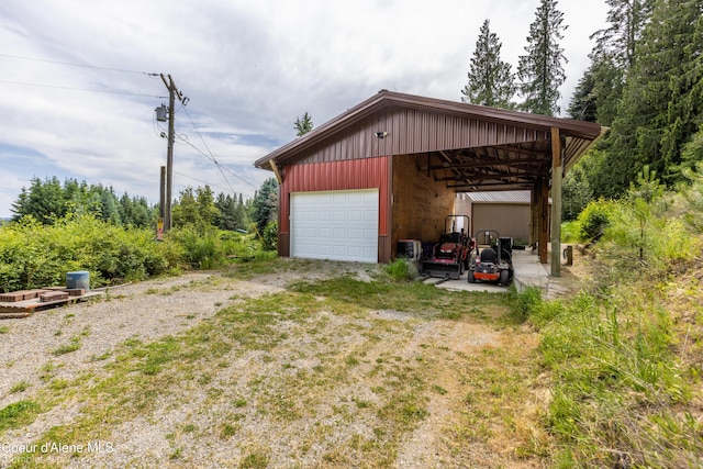 19441 N Rustic Ridge Trl, Rathdrum, ID 83858 - garage with a detached garage and dirt driveway