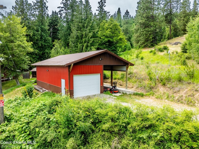 19441 N Rustic Ridge Trl, Rathdrum, ID 83858 - view of outbuilding with driveway and a wooded view