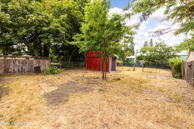 421 W Walnut Ave, Coeur Dalene, ID 83814 - fenced backyard with a storage shed